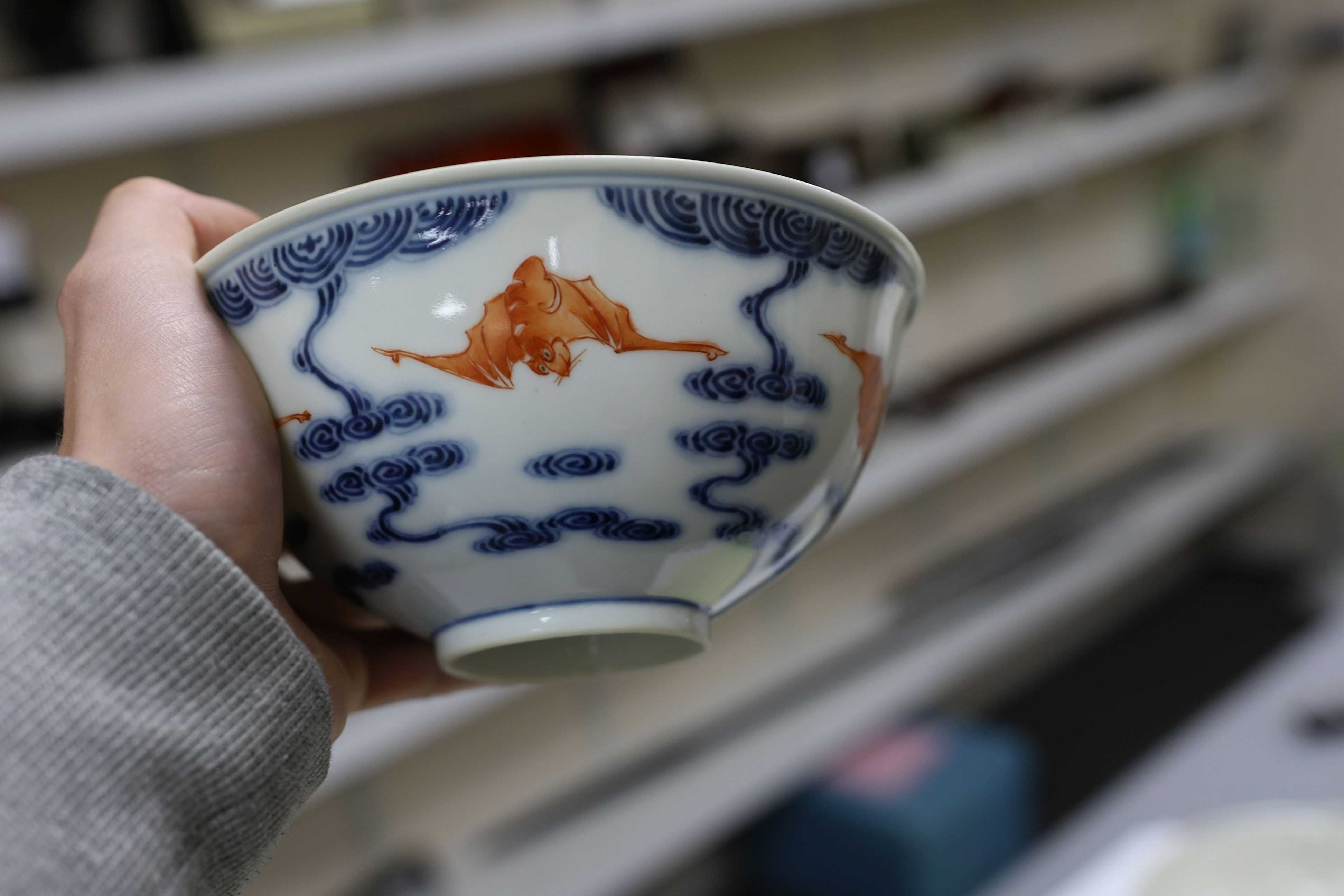 A pair of Chinese iron red and underglaze blue ‘five bat’ bowls, Guangxu mark and probably of the period (1875-1908), 16.5cm diameter